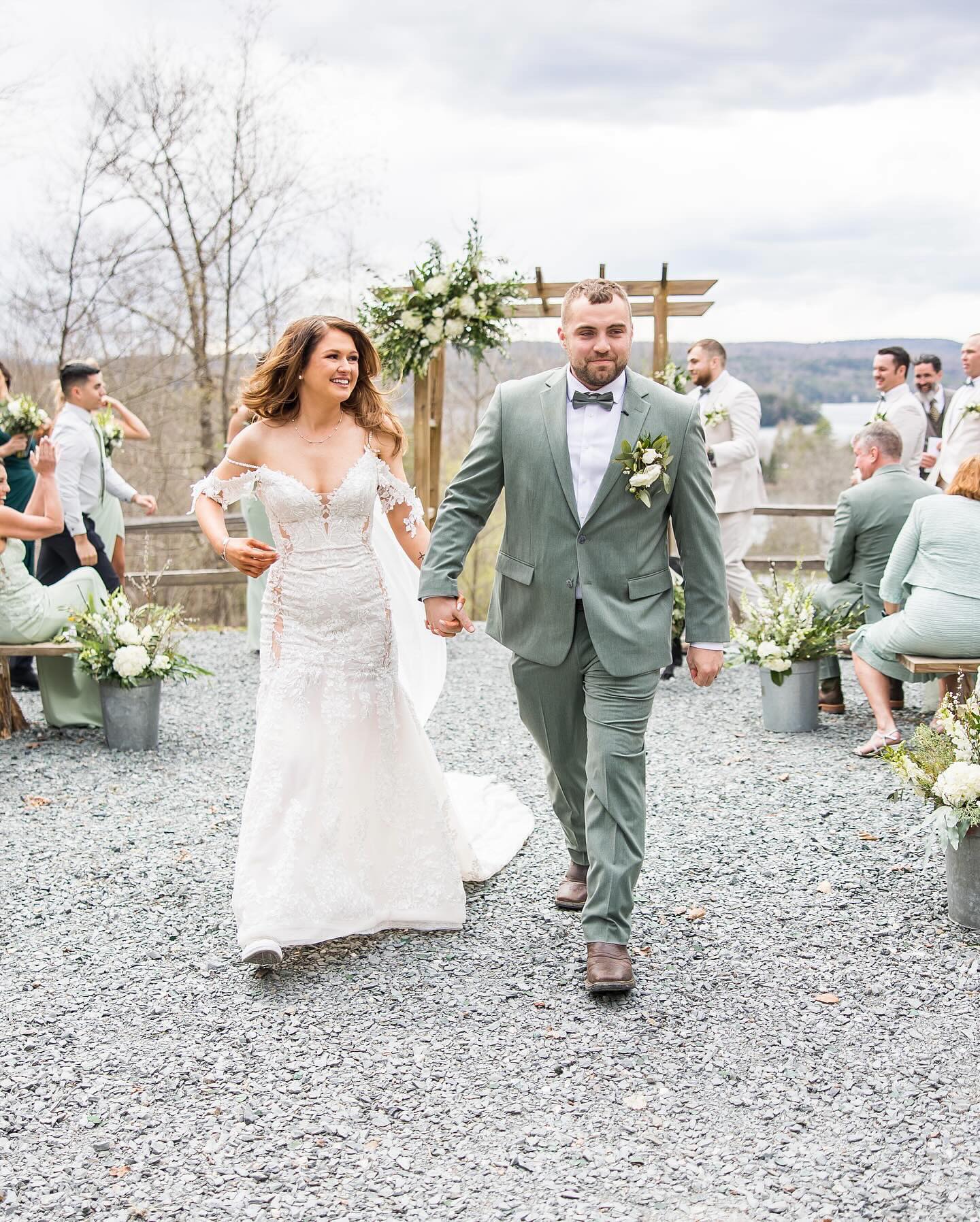 The ceremony ends, and a heavy silence of collective joy breaks into applause. Two people walk down a gravel path, hands tightly interlaced, floating on pure adrenaline. She wears a lace gown that catches the soft Vermont light with every step. He walks beside her in a sage suit, a look of quiet triumph on his face. Behind them, the vast Green Mountains stand as silent witnesses to this new beginning. This fleeting moment of "just married" bliss is exactly why we capture it. High-end Vermont Wedding Photography is not just a service; it is the preservation of this lightning. The Emotional Gravity of Choosing Vermont Wedding Photography When the flowers fade and the cake is gone, only the images remain. They become the tangible evidence of the day your family’s history shifted forever. For many, the question of cost is really a question of long-term value. You are not just paying for someone to stand there with a professional camera. You are investing in a guardian who recognizes the weight of a grandmother’s tear. Vermont Wedding Photography serves as a permanent bridge back to these high-stakes emotional highs. It ensures that forty years from now, the feeling of that gravel path stays vivid. These photos are the only part of your budget that increases in value. Capturing the Narrative Through Full Day Coverage in Vermont A wedding is a story with a beginning, a middle, and a joyous end. Skipping the "getting ready" moments or the late-night dancing leaves gaps in your legacy. Opting for full day wedding photography coverage in Vermont ensures the entire arc is preserved. From the nervous laughter in the morning to the final, exhausted embrace at midnight. This comprehensive approach allows the narrative to breathe without the pressure of a ticking clock. It gives your photographer the space to find the unscripted, quiet beauty between events. True storytelling requires a commitment to being present for the whole journey, not just highlights. Visual Elements: Harmony Between the Couple and the Landscape The aesthetic of a Vermont wedding is defined by a rugged, natural elegance. Sage green suits and delicate floral lace create a perfect harmony with the outdoors. Even under an overcast sky, the colors pop against the soft, muted mountain backdrop. This visual balance is intentional, reflecting a couple that is grounded yet celebratory. A candid wedding photographer Vermont families trust knows how to use these elements. They use the natural lines of the wooden arbor and the gravel to frame joy. Every choice—from the bridesmaid’s gowns to the floral pails—contributes to a cohesive visual identity. Experience During the Session: Finding Natural and Human Moments The best photos happen when you forget the camera is even there at all. It takes an experienced hand to cultivate an environment where you feel totally free. You shouldn’t feel like you are on a film set with rigid, forced poses. Instead, the process should feel like a natural extension of your celebration’s energy. This comfort allows for the "in-between" shots that often become a couple’s favorite images. Whether it is a shared glance or a burst of laughter, these are genuine. A professional guides you just enough to ensure the light is perfect while staying invisible. The Subtle Difference of an Affordable Wedding Photographer VT Budgeting shouldn't mean sacrificing the soul of your wedding gallery or your memories. Finding an affordable wedding photographer VT couples love is about finding technical heart. It is about a professional who works efficiently without losing the emotional resonance of the day. They understand how to manage the logistical challenges of mountain venues with expert grace. They prioritize the moments that matter most to you, ensuring your investment is utilized wisely. High-quality imagery should be accessible to those who value their history and their future. True value is found where technical mastery meets a deep passion for people. Reflecting on the Meaning and Value of Vermont Wedding Photos Long after the guests have gone home, your Vermont Wedding Photos remain. They sit on your mantle and live in albums passed down to children. They are the visual anchor for the promises you made beneath the open sky. Every time you look at them, you should feel that same mountain breeze. This investment is about honoring the version of yourself that said "I do." It is about making sure the joy of that walk remains a permanent fixture. Your legacy is worth the care, the detail, and the professional heart of a strategist. Expert Wedding Photography Investment FAQs •Is full-day coverage necessary for a smaller mountain wedding? Yes, because small weddings often have the highest density of intimate, unscripted emotional moments. •How can we ensure our photos do not look overly staged or stiff? Choose a photographer who prioritizes candid interaction and movement over traditional, static posing techniques. • What is the most important factor when choosing a photographer in Vermont? Look for someone whose portfolio shows they can handle the state's unique, shifting natural lighting. • Will an affordable photographer still provide high-end editing? Experienced professionals offer consistent, timeless editing regardless of the package size to protect their brand.