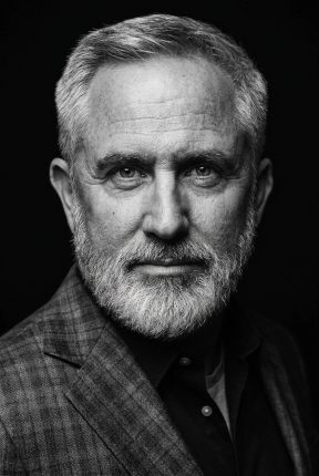 A powerful black and white business portrait captured inside a creative headshot studio Vermont professionals trust.