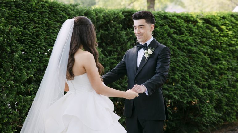 Vermont Wedding Photography capturing an emotional first look moment between bride and groom in a garden setting